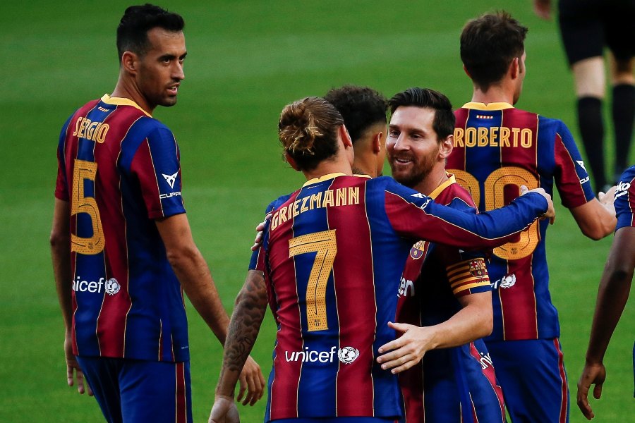 Messi y Griezmann durante un partido con Barcelona