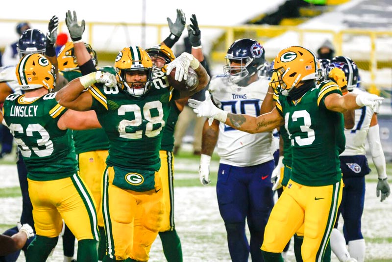 A.J. Dillon festeja un touchdown con Packers