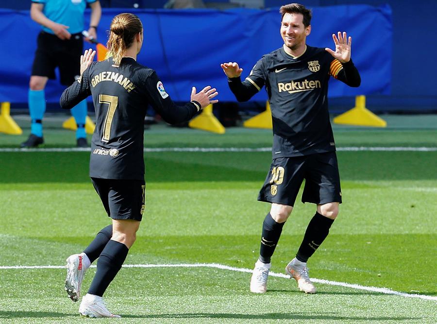 Messi y Griezmann celebrando un gol