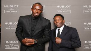 Usain Bolt y Pelé durante una celebración