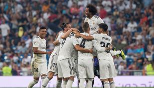 Jugadores del Real Madrid celebran una anotación ante el Leganés