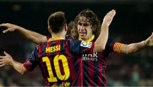 Messi y Puyol celebrando una anotación 