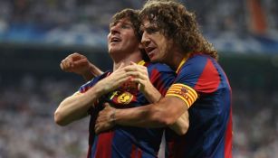 Messi y Puyol juntos durante un partido de Barcelona 